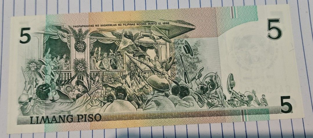 Philippines 5 Piso Banknote Emilio Aguinaldo (Category: Currency) located in Paranaque City. Submitted by independentman07 (Listing ID 1465760731, Image 2). Description: - Denomination: Philippine 5 Piso banknote - Front Design: Emilio Aguinaldo - Back Design: Declaration of Philippine Independence on June 12, 1898 - Serial Number: CA100059 - Condition: Crisp paper quality with clean edges and vibrant multi-color design - Ideal for: Currency coll