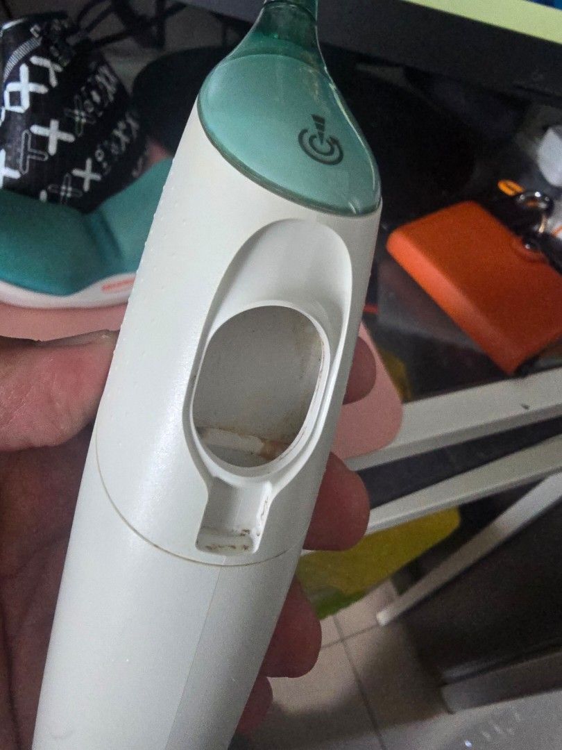 Philips Sonicare AirFloss HX8240 with Charging Base (Category: Oral Care) located in Taguig. Submitted by jollero (Listing ID 1465867697, Image 2). Description: - Item: Philips Sonicare AirFloss (Model HX8240, Assembled in Mexico) - Includes: White and green handle + matching charging base station with power cord - Power: Built-in rechargeable lithium-ion battery (powers up normally on charger) - Condition: Used, with some visible mineral buildup