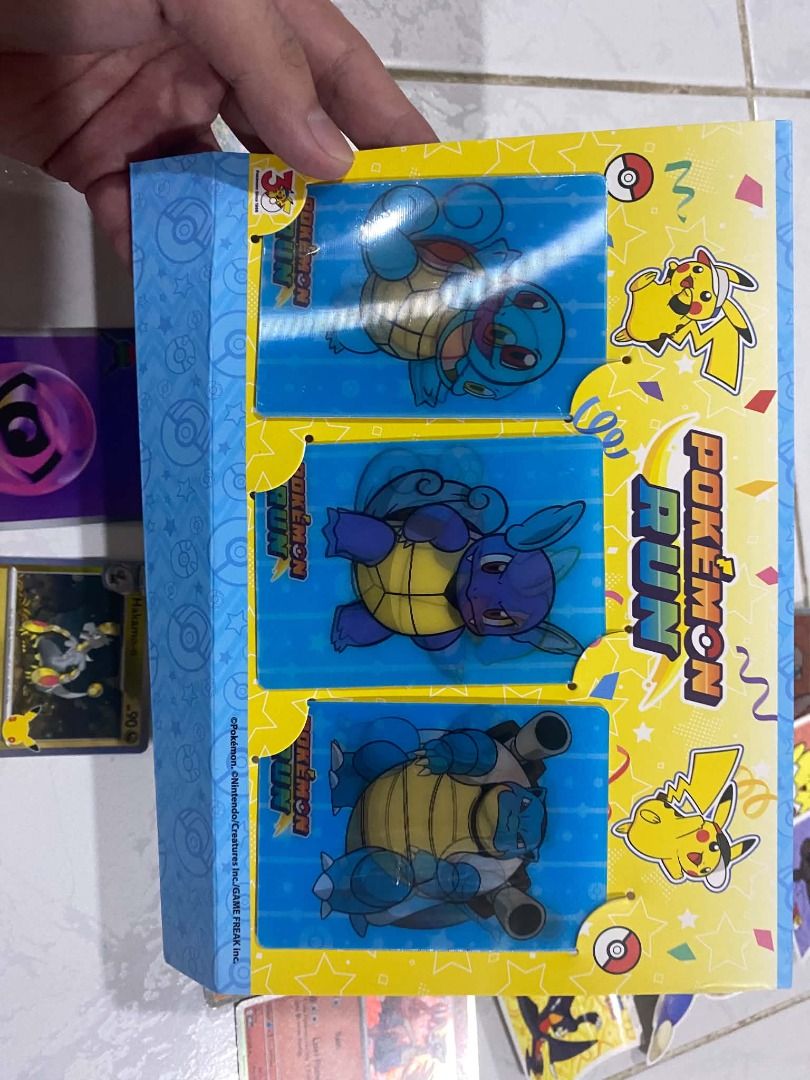Pikachu 131 (Category: Raw Singles) located in Taguig. Submitted by wyllowdigi11748 (Listing ID 1465949301, Image 2). Description: Open for Negotiation Includes all in the picture, - Pokemon Run Pikachu Promo Cards - Squirtle Evolution Lenticular Cards 3x, - Official Stickers, - Boosterpack (opened) Can include Pokemon Run 30th Badge Pin (Additional 1,500) .