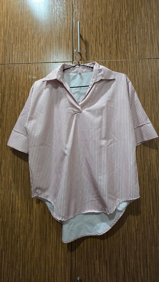 Pink and White Striped shirt (Category: Blouses) located in Cebu City. Submitted by kitty_12345_ (Listing ID 1465857010, Image 1). Description: - Color/Pattern: Pink and white vertical stripes - Size: L - Design: Button-down, collar neckline, folded sleeve cuffs, and curved hem - Material: Lightweight and comfortable fabric - Style: Casual everyday top, easy to pair with jeans or skirts MOP: gcash, mari, maya, gotyme MOD: Lbc Meetup: Parkmall.