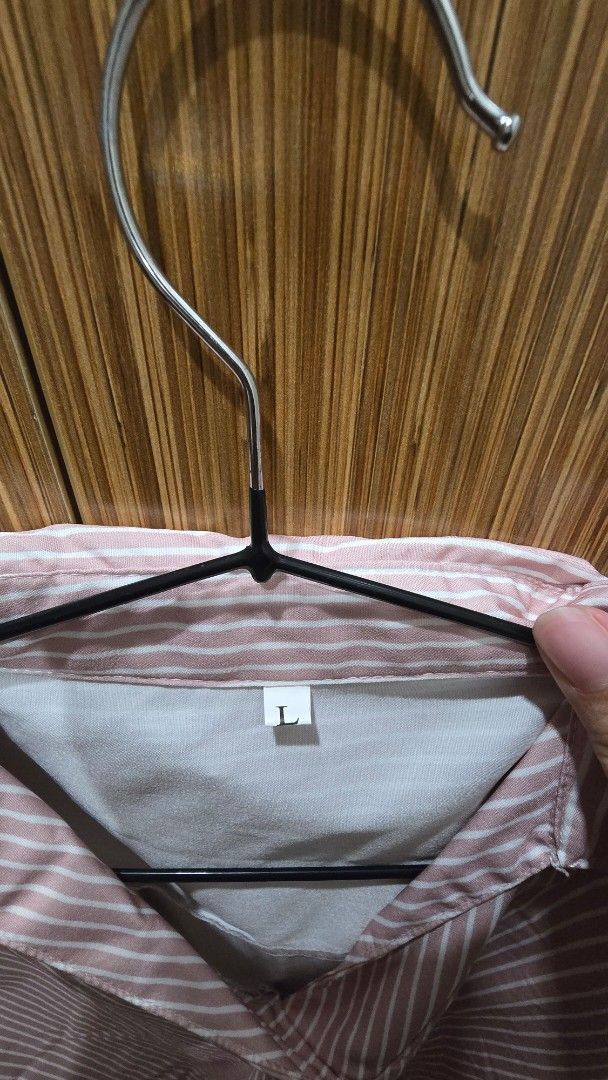 Pink and White Striped shirt (Category: Blouses) located in Cebu City. Submitted by kitty_12345_ (Listing ID 1465857010, Image 3). Description: - Color/Pattern: Pink and white vertical stripes - Size: L - Design: Button-down, collar neckline, folded sleeve cuffs, and curved hem - Material: Lightweight and comfortable fabric - Style: Casual everyday top, easy to pair with jeans or skirts MOP: gcash, mari, maya, gotyme MOD: Lbc Meetup: Parkmall.