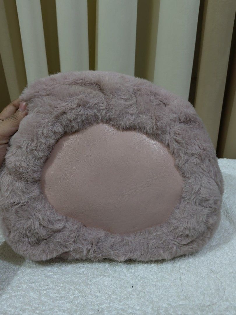 Pink Faux Fur Make Up Pouch (Category: Shoulder Bags) located in Makati City. Submitted by prelovedtreatedwithlove (Listing ID 1465825066, Image 2). Description: - Super soft fluffy pink bucket bag with cute bunny ears - Drawstring closure with two large white fluffy pom-poms - Flat pink base keeps the bag standing upright - Smooth black fabric lining on the inside - Perfect for make up or anik anik for travel -No issue A-236.
