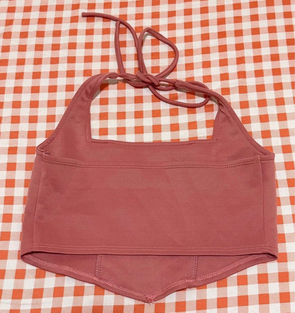 Pink Halter Top Pointed Hem Square Neck (Category: Sleeveless) located in Quezon City. Submitted by itsmesummeeer (Listing ID 1465943931, Image 2). Description: - Color: Dusty pink - Design: Square neckline with tie-back halter strap - Fit: Stretchy and super flattering - Styling: Great for casual day outs or paired with high-waisted jeans - Size: Chest - 13.5”.