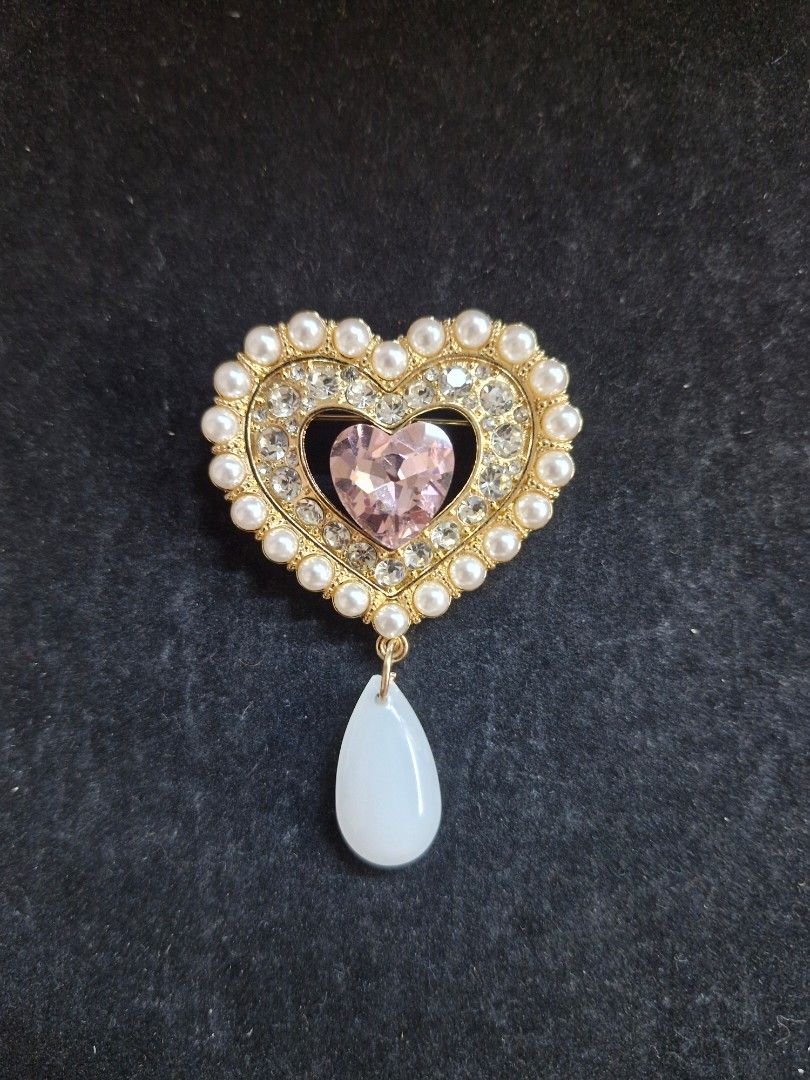 Pink Heart Tassel Brooch (Category: Brooches) located in Taguig. Submitted by mommaschoice (Listing ID 1465789527, Image 1). Description: Brand New Adorned w/ faux pearls & pink rhinestone Lightweight won't damage the fabric Ships nationwide.