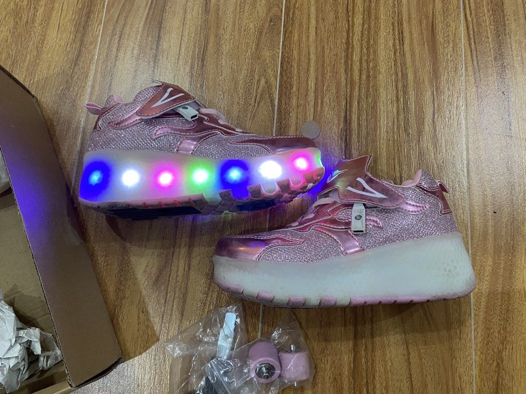 Pink LED Roller Shoes Size 33 with Wheels (Category: Babies & Kids Fashion) located in Mandaluyong City. Submitted by joytotheworld-preloved (Listing ID 1465911000, Image 2). Description: - Sparkly pink roller shoes with fun multi-color LED lights in the soles - Size: 33 - Versatile 2-in-1 design: easily attach wheels to roll or store them to walk normally - Complete set includes extra replacement wheels and mounting hardware - Comes with the ori