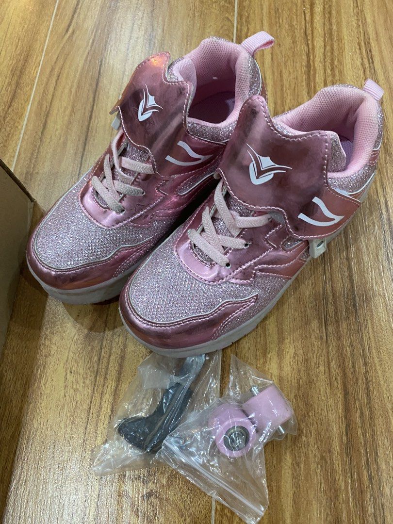 Pink LED Roller Shoes Size 33 with Wheels (Category: Babies & Kids Fashion) located in Mandaluyong City. Submitted by joytotheworld-preloved (Listing ID 1465911000, Image 1). Description: - Sparkly pink roller shoes with fun multi-color LED lights in the soles - Size: 33 - Versatile 2-in-1 design: easily attach wheels to roll or store them to walk normally - Complete set includes extra replacement wheels and mounting hardware - Comes with the ori