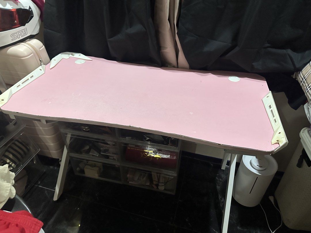 Pink Panther Gaming Desk with White Frame (Category: Office Furniture & Fixtures) located in Antipolo. Submitted by queensesareginaamora (Listing ID 1465919555, Image 1). Description: - Pink gaming desk with durable white metal legs and white corner guards - Panther branding on the side leg support - Features cable management holes on the top for a clean setup - Great size for gaming rigs or study areas - Condition: Sturdy build with some normal 