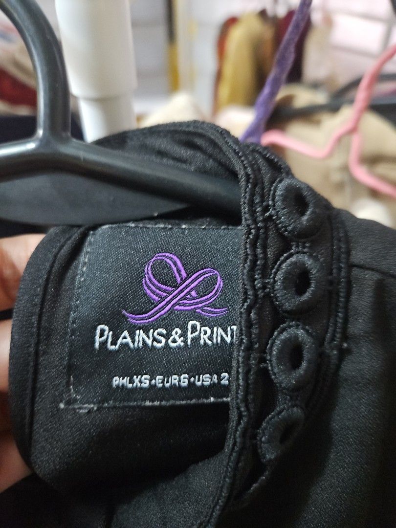 Plains & Prints Black Long Sleeve Blouse Size 2 (Category: Longsleeves) located in Calamba. Submitted by handpickedbynetty (Listing ID 1465835146, Image 2). Description: - Brand: Plains & Prints - Size: 2 - Color: Solid Black - Material: Lightweight and comfortable fabric - Design: Round neckline with eyelet embroidery detailing - Sleeves: Matching decorative eyelet trim along arms and cuffs.