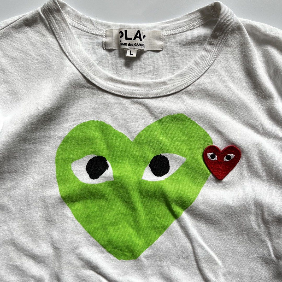 Play By Comme Des Garcons Two Heart Shape Tee (Category: Shirts) located in Makati City. Submitted by merto_side (Listing ID 1465827076, Image 2). Description: Play By Comme Des Garcons Two Heart Shape Tee Dimes:W19xL23 Issue:ink point Complete papers ₱450 +Shipping fee.