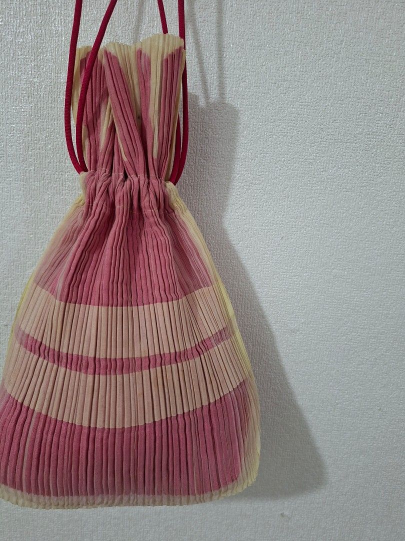 Pleats please by Issey miyaki drawstring bag (Category: Purses & Pouches) located in Cavite. Submitted by labbudds20 (Listing ID 1465952842, Image 3). Description: pleats please by Issey miyaki drawstring bag small size width 6 inches length 11 inches excellent to new condition see pictures for details.