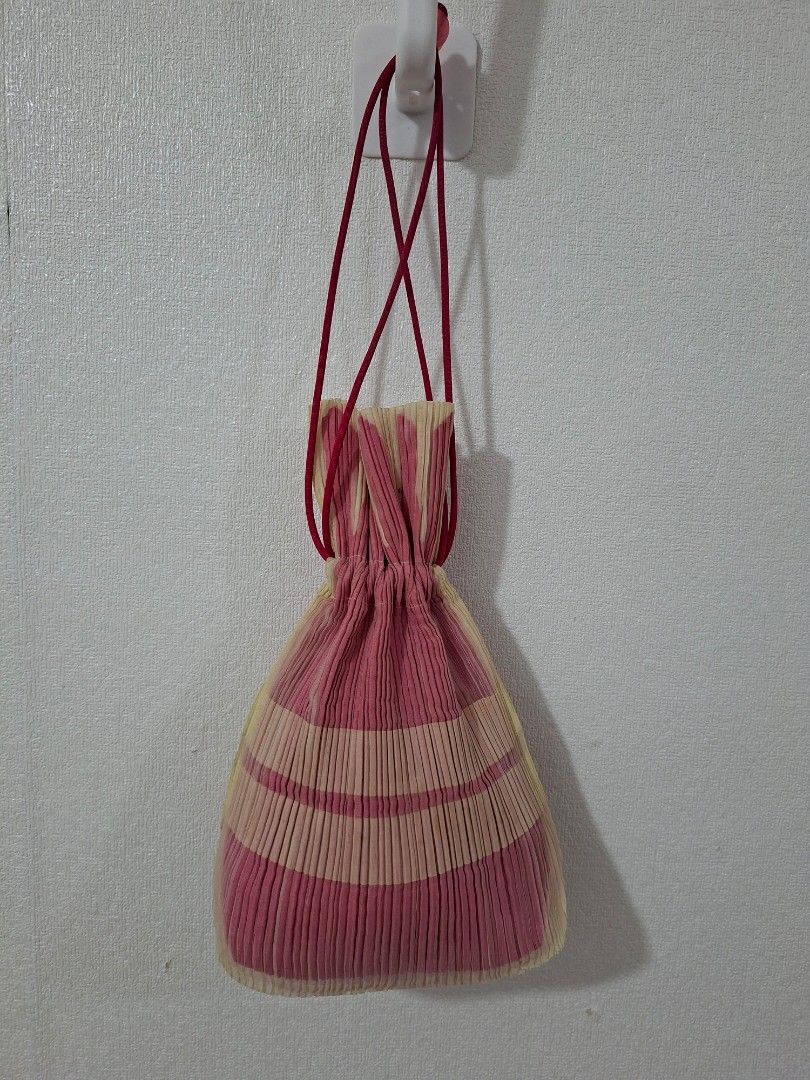 Pleats please by Issey miyaki drawstring bag (Category: Purses & Pouches) located in Cavite. Submitted by labbudds20 (Listing ID 1465952842, Image 2). Description: pleats please by Issey miyaki drawstring bag small size width 6 inches length 11 inches excellent to new condition see pictures for details.