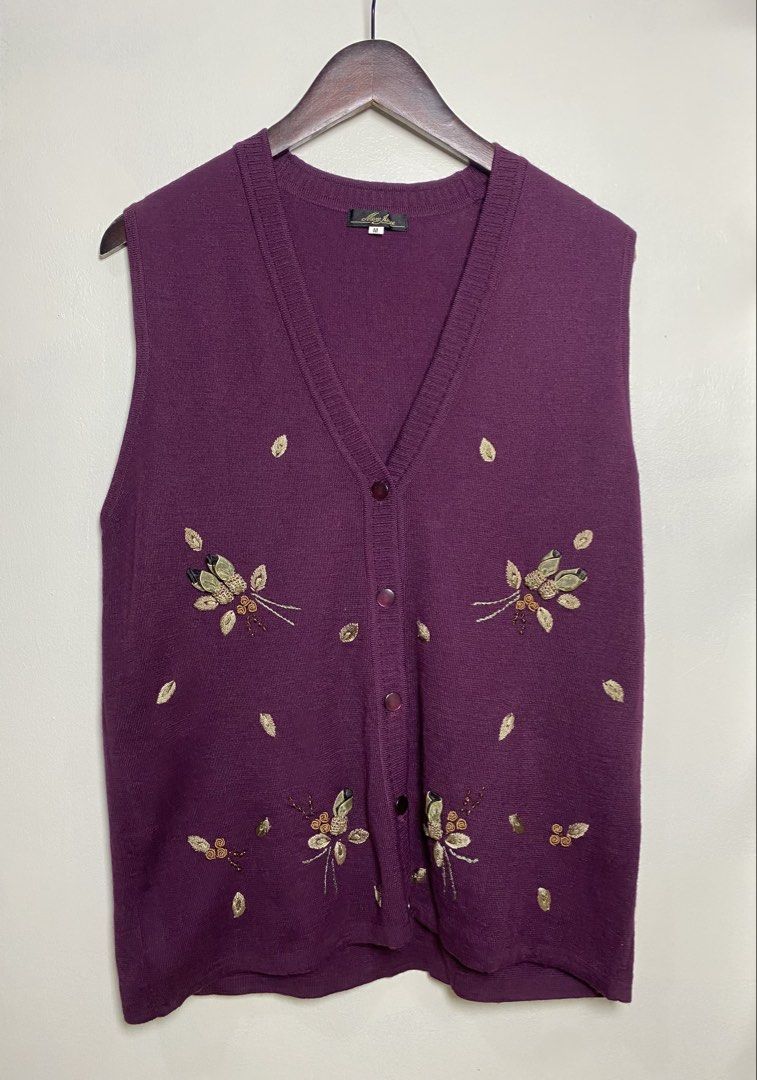 Plum embroidered knitted vest (Category: Others Tops) located in Makati City. Submitted by indaysukaycloset (Listing ID 1465806396, Image 1). Description: PLUM EMBROIDERED VEST Brand: Mere Ainee (Japan Brand) Size: M on tag - Fits M-L Color: Plum / Purple with gold floral embroidery Details: - W-19.5 L-25 (laid flat, in inches) - V-neck button-down knit vest - Front 5-button closure (with extra button tag included) - 3D floral embroidery with rib