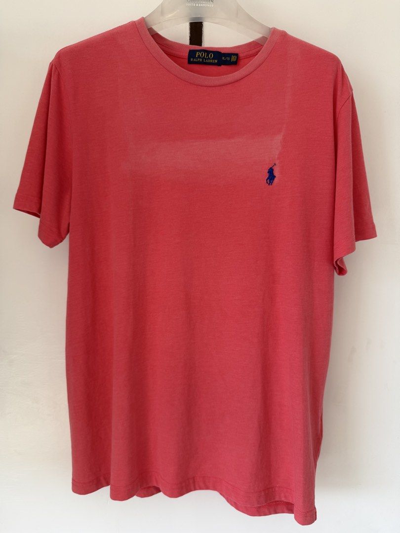 Polo Ralph Lauren Pink Tee (Category: Shirts) located in Quezon City. Submitted by satisfied_buyer (Listing ID 1465763393, Image 1). Description: - Brand: Polo Ralph Lauren - Style: Crewneck t-shirt - Color: Pink with blue embroidered pony logo - Size: XL - Material: 100% Cotton - Condition: Clean with standard wear Shoulders 47 m Chest 53m Length 73m.