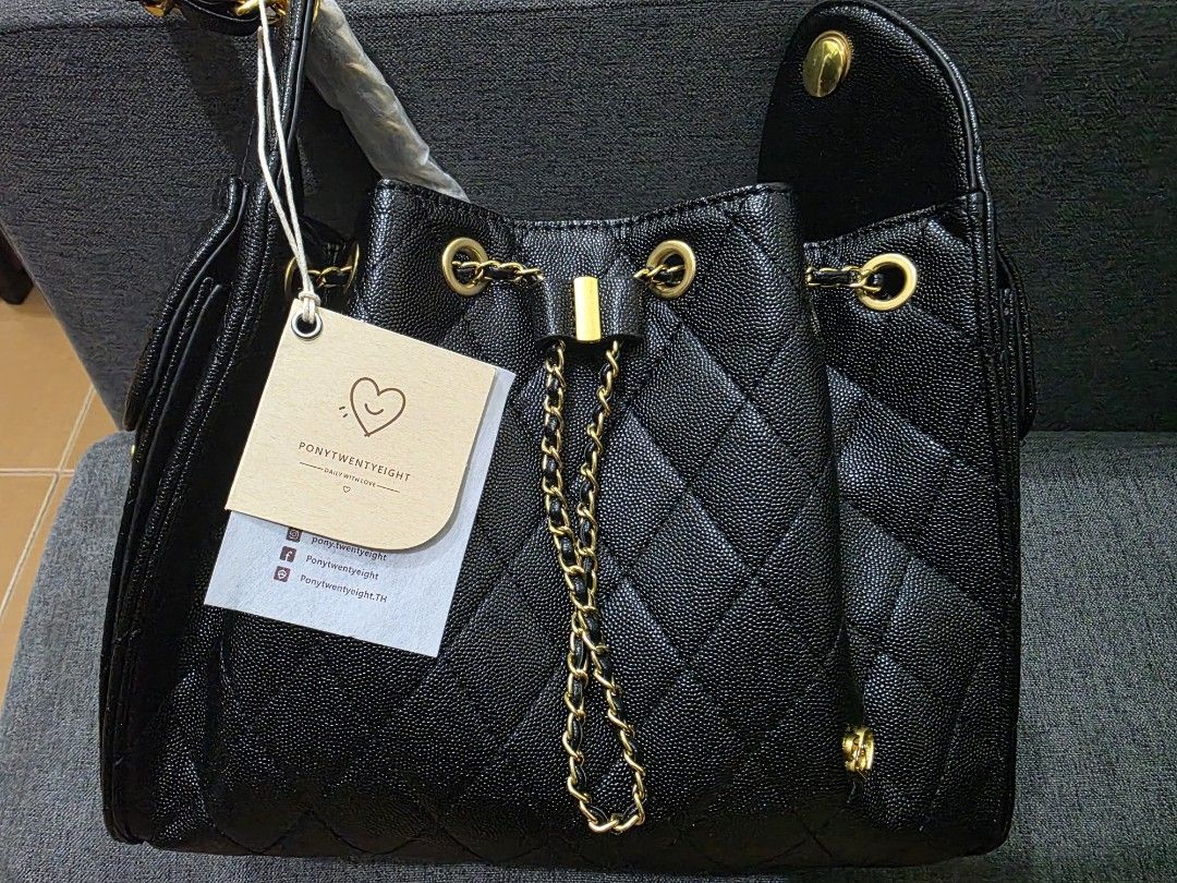 Pony Twenty Eight Deco Large (Category: Luxury Bags & Wallets) located in Pasig City. Submitted by shengshenge (Listing ID 1465860183, Image 1). Description: - Brand: Pony Twenty Eight Deco Large - Style: Black quilted bucket bag with structured sides and snap details ; Ch@nel 25 inspired - Hardware: Elegant gold-tone chain and metal accents - Closure: Drawstring closure - Condition: Brand new with tag still attached to the strap - Inclusions: Co