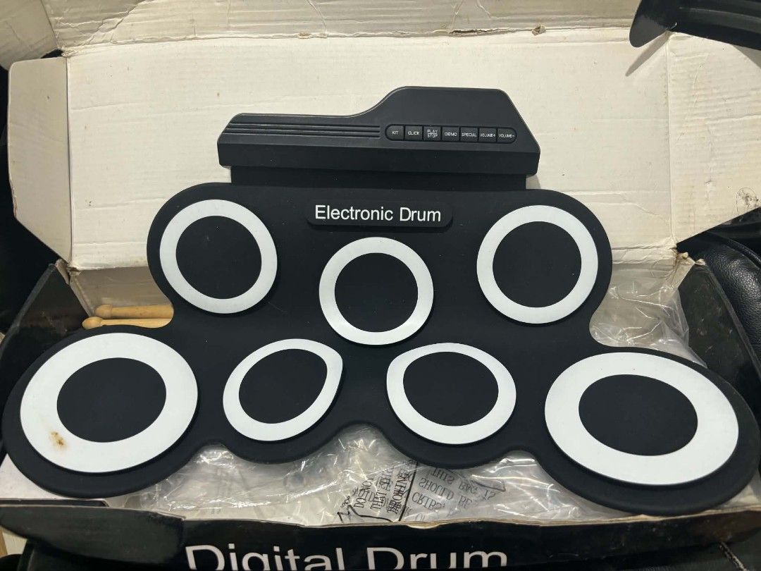 Portable Electronic Roll Up Drum Pad Set (Category: Musical Instruments) located in Caloocan City. Submitted by sophiasara55546 (Listing ID 1465916404, Image 3). Description: - Portable electronic drum pad set in stylish black and white - Roll-up silicone design, great for small spaces and home practice - Complete set includes: 2 sustain pedals, drum sticks, USB cable, audio cable, and user manual - Original box included - Condition: Excellent, r