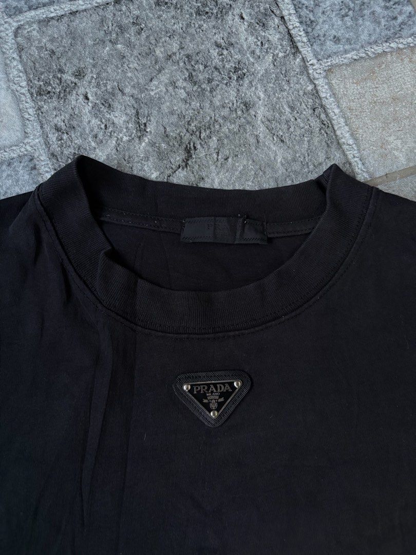 Prada Tee (Category: Tshirts & Polo Shirts ) located in Manila. Submitted by nofits.garments (Listing ID 1465836813, Image 3). Description: Prada Tee Boxy fit Large Width 23 Length 25 Good as new No issue.