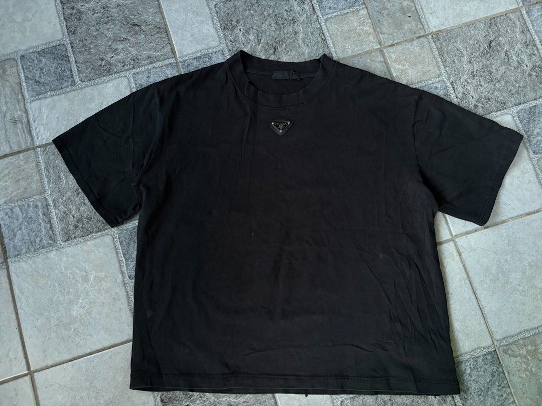 Prada Tee (Category: Tshirts & Polo Shirts ) located in Manila. Submitted by nofits.garments (Listing ID 1465836813, Image 2). Description: Prada Tee Boxy fit Large Width 23 Length 25 Good as new No issue.
