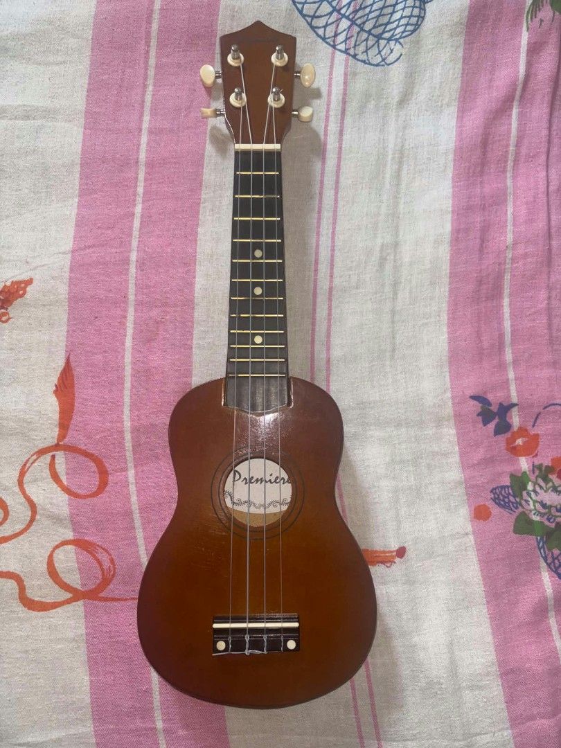 Premiere Ukulele Wooden Instrument (Category: Musical Instruments) located in Trece Martires City. Submitted by unshelved_ph (Listing ID 1465857874, Image 1). Description: Ukulele for Sale‼️ 📌Premiere Ukulele Freebies: ✅Ukulele Bag ✅2 Guitar Picks 👉Barely used (ginamit lang for a school performance) 👉In good condition 👉Scratches do not affect the instrument's performance - DM for more info - CO through DM. If shipping, it will be through J&T 