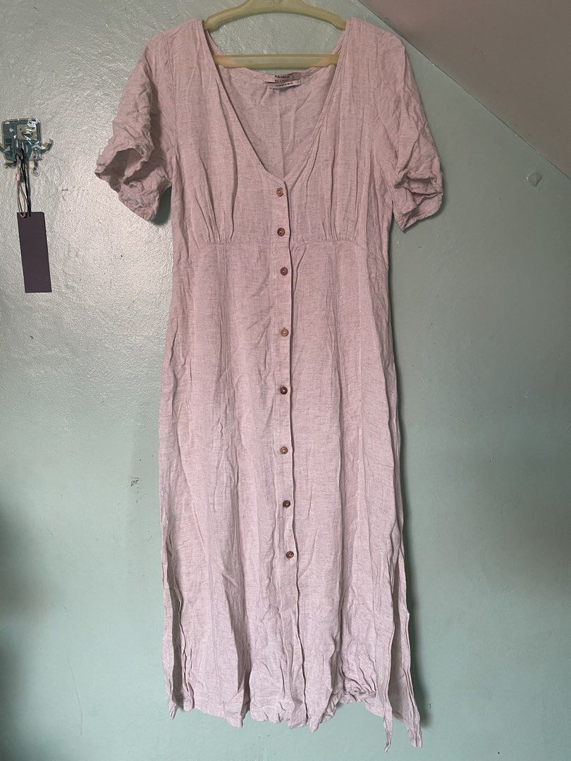 Pull & Bear Cream Midi Dress Size M (Category: Dresses) located in Baybay. Submitted by shikita27906 (Listing ID 1465841925, Image 1). Description: - Brand: Pull & Bear - Size: M (Made in Morocco) - Color: Cream with brown front buttons - Style: V-neck, short sleeves, fitted bodice, flared skirt - Material: Lightweight, breathable linen-like fabric - Condition: Great for casual everyday wear and warmer weather.