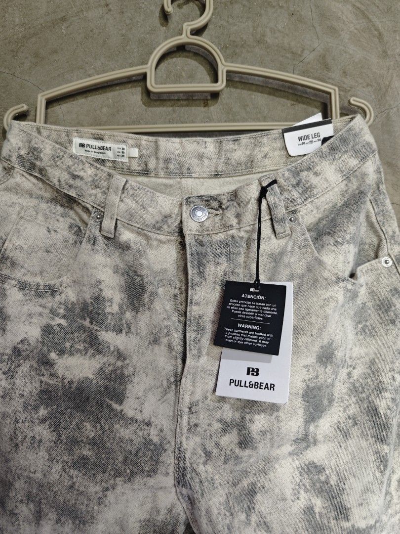 Pull&Bear Wide Leg Jeans Grey Tie Dye Size EUR 38 (Category: Jeans) located in Alaminos. Submitted by zckbik (Listing ID 1465763365, Image 2). Description: - Brand: Pull&Bear - Style: Wide leg jeans - Color/Wash: Grey and white tie-dye with heavy distressing dye effect - Condition: Brand new with tags (BNWT), never worn - Size: EUR 38, USA 30, MEX 30 - Origin: Made in Bangladesh this is brand new 3k original price .