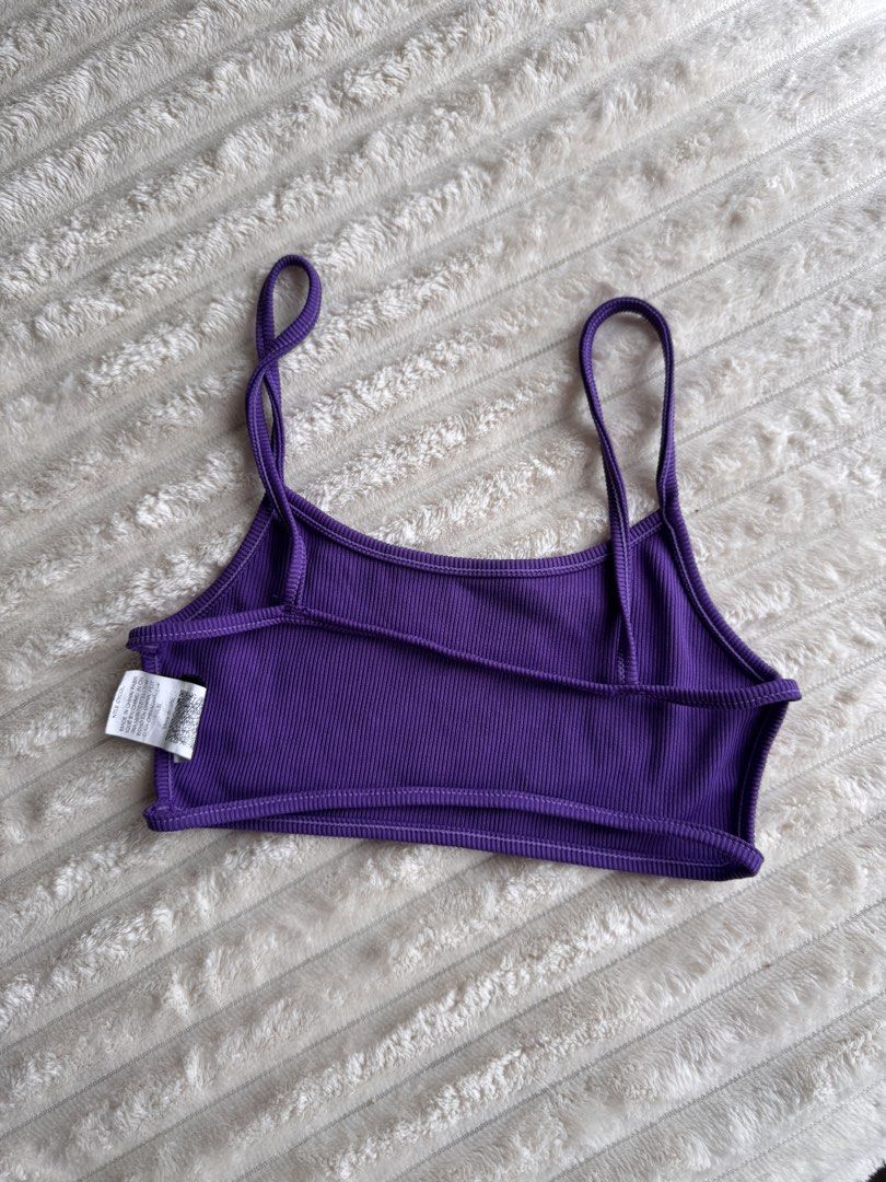 Purple Ribbed Crop Top with Double Straps (Category: Sleeveless) located in Manila. Submitted by bellebeauty.2002 (Listing ID 1465775555, Image 2). Description: - Color: Vibrant purple - Material: Stretchy, lightweight ribbed fabric - Design: Unique double strap with split hem cutout - Fit: Crop top style, easy to pair with high-waisted bottoms - Condition: Brand new / Excellent (ready to wear).