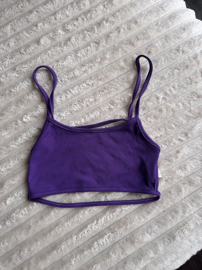 Purple Ribbed Crop Top with Double Straps (Category: Sleeveless) located in Manila. Submitted by bellebeauty.2002 (Listing ID 1465775555, Image 1). Description: - Color: Vibrant purple - Material: Stretchy, lightweight ribbed fabric - Design: Unique double strap with split hem cutout - Fit: Crop top style, easy to pair with high-waisted bottoms - Condition: Brand new / Excellent (ready to wear).