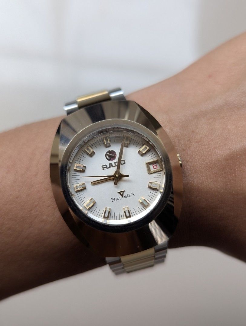 Rado Balboa Automatic Two-Tone Watch (Category: Luxury Watches) located in Quezon City. Submitted by dustydialsph (Listing ID 1465813489, Image 1). Description: Vintage Rado Balboa watch. Silver and gold two-tone bracelet and case. White textured dial with gold hour markers and hands. Date window at three o'clock with red numbers. Signed crown with the Rado anchor logo. Case back stamped with water sealed details and serial number 74044781A. Auto