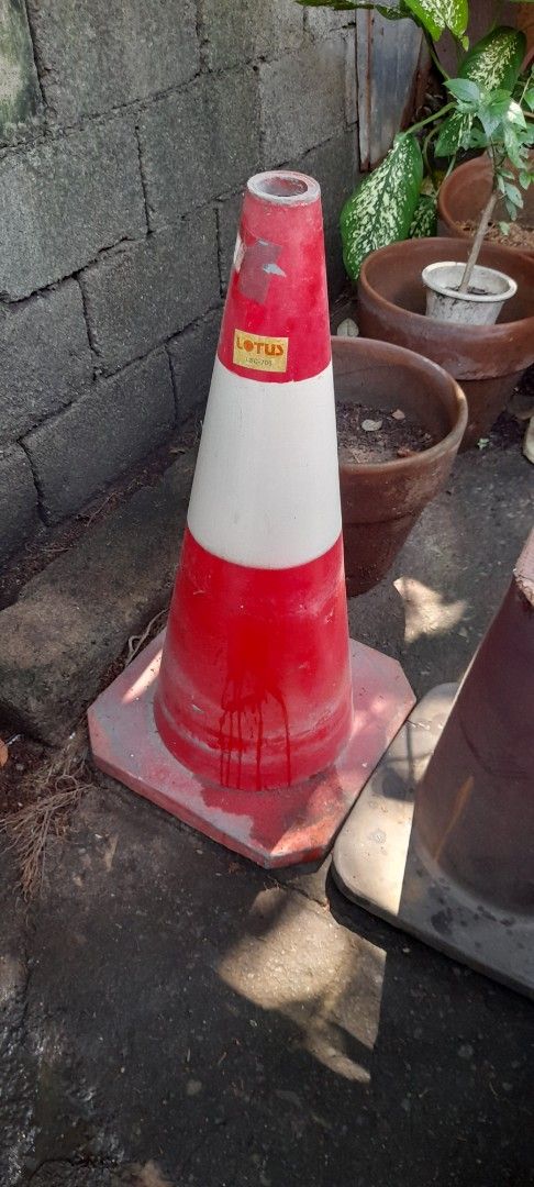Red and white traffic safety cone with sturdy base (Category: Industrial Equipment) located in Valenzuela. Submitted by newbear.425b6e (Listing ID 1465833159, Image 2). Description: - Item: Heavy-duty red and white traffic cone - Condition: Normal wear from outdoor storage, solid and fully functional - Features: Heavy weighted base for outdoor stability, painted stripes - Best For: Parking spaces, driveway safety, and construction marking - Deliv