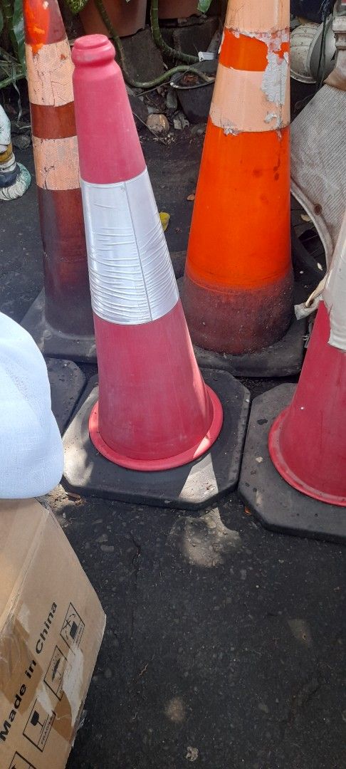 Red and white traffic safety cone with sturdy base (Category: Industrial Equipment) located in Valenzuela. Submitted by newbear.425b6e (Listing ID 1465833159, Image 1). Description: - Item: Heavy-duty red and white traffic cone - Condition: Normal wear from outdoor storage, solid and fully functional - Features: Heavy weighted base for outdoor stability, painted stripes - Best For: Parking spaces, driveway safety, and construction marking - Deliv