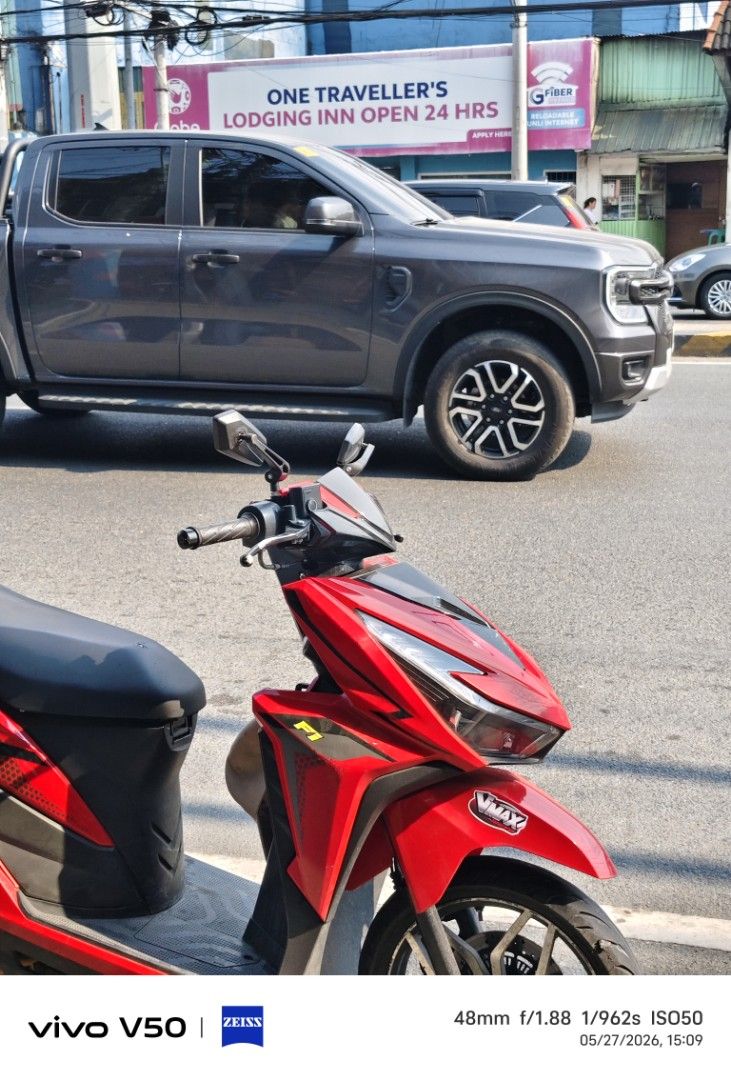 Red Automatic Scooter Motorcycle (Category: Motorbikes for Sale) located in Manila. Submitted by pieces1996 (Listing ID 1465897876, Image 1). Description: Bright red automatic scooter. Black seat and floorboards. Custom F1 and Vmax stickers on the front fairing. Sharp angular headlight design with LED strips. Side mirrors installed on the handlebars. Alloy wheels with black finish. Clean body panels and standard handlebar grips..