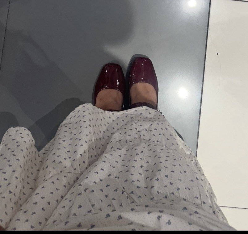 Red doll shoes (Category: Flats & Sandals) located in Pasig City. Submitted by asiaimnida (Listing ID 1465933316, Image 3). Description: - Style: Burgundy patent Mary Jane with square toe and low block heel - Details: Slim buckled ankle strap, white inner sole with gold logo - Condition: Worn a few times, minimal wear on inner soles - Perfect for: Vintage outfits, long skirts, and everyday chic.