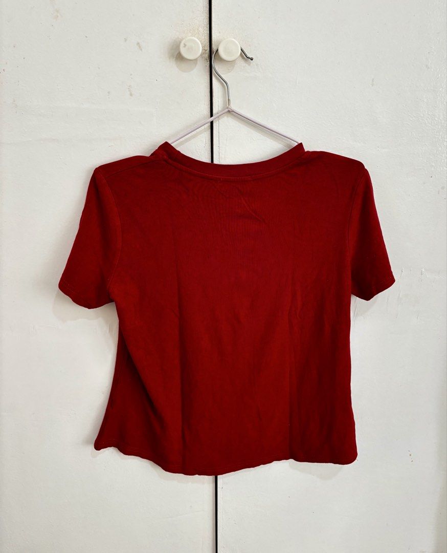 Red Plain Shirt (Category: Shirts) located in Manila. Submitted by dianafayesimbre (Listing ID 1465841823, Image 2). Description: - Color: Rich red - Material: Soft, comfortable cotton - Neckline: Round neck with trendy exposed seam stitching - Style: Casual short sleeve top with a solid back - Versatility: Pairs easily with high-waisted jeans or skirts - Condition: Clean and well-kept - Fits M to semi XL - Very stretchable and thick fabric.