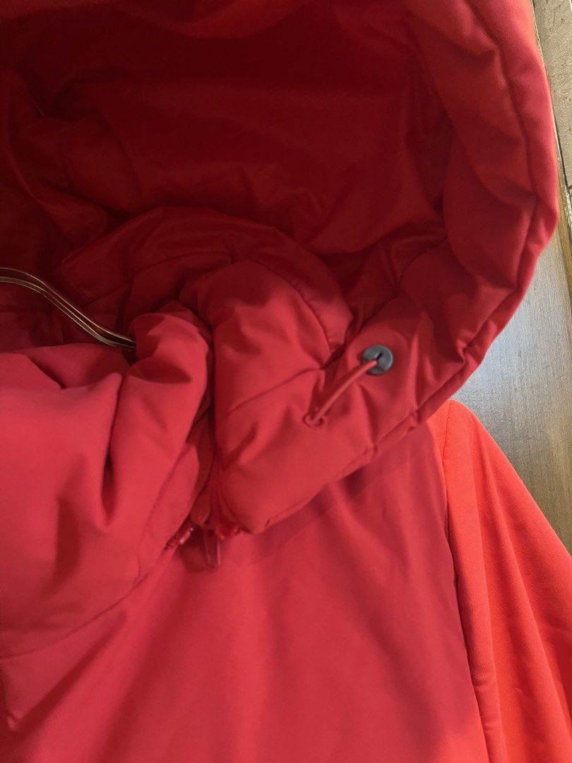 Red Puffer Jacket with Removable Hood (Category: Coats, Jackets and Outerwear) located in Las Pinas. Submitted by francesaly (Listing ID 1465923183, Image 2). Description: - Bright red winter jacket with warm insulated padding - Convenient full zip front closure - Removable zip-off hood for two different looks - Deep side pockets for warming hands and storage - Adjustable drawstrings on the hood for a custom fit - Great layering piece for cold we