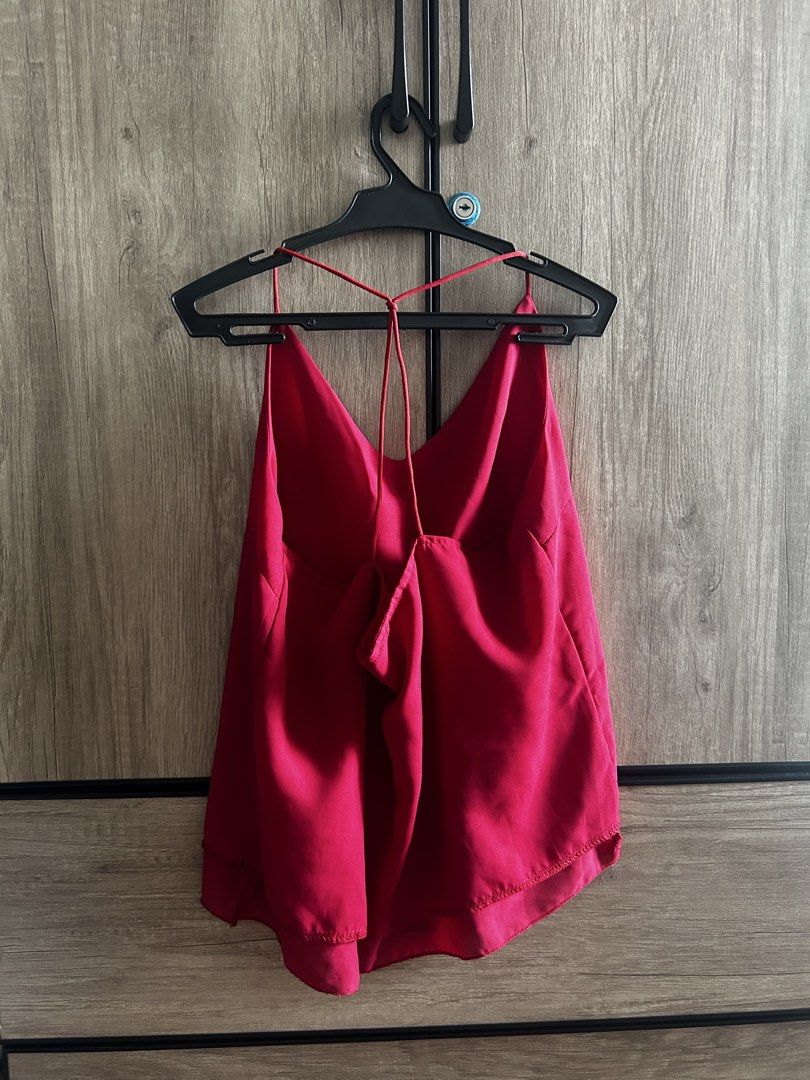 Red Satin Cami Top with Back Straps (Category: Sleeveless) located in Makati City. Submitted by magwayr19 (Listing ID 1465801917, Image 2). Description: - Color: Bright red - Material: Lightweight satin - Design: Cowl front, adjustable criss-cross back straps, flowy layered hem - No brand - Small can fit to medium.