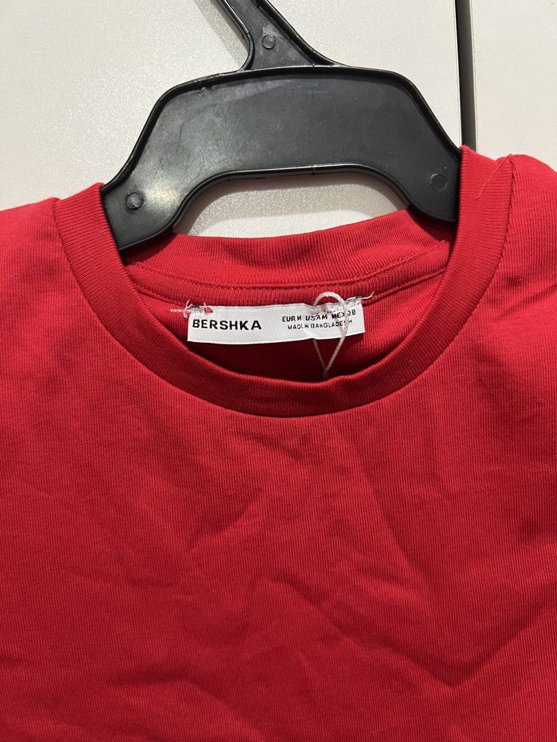 Red Short Sleeve Tee (Category: Shirts) located in Manila. Submitted by art8411_ (Listing ID 1465926004, Image 2). Description: - Brand: Bershka - Color: Bright red - Size: Medium (M) - Fit: Slim fit silhouette with short sleeves - Material: Soft cotton blend - Condition: Brand new with original tags attached.