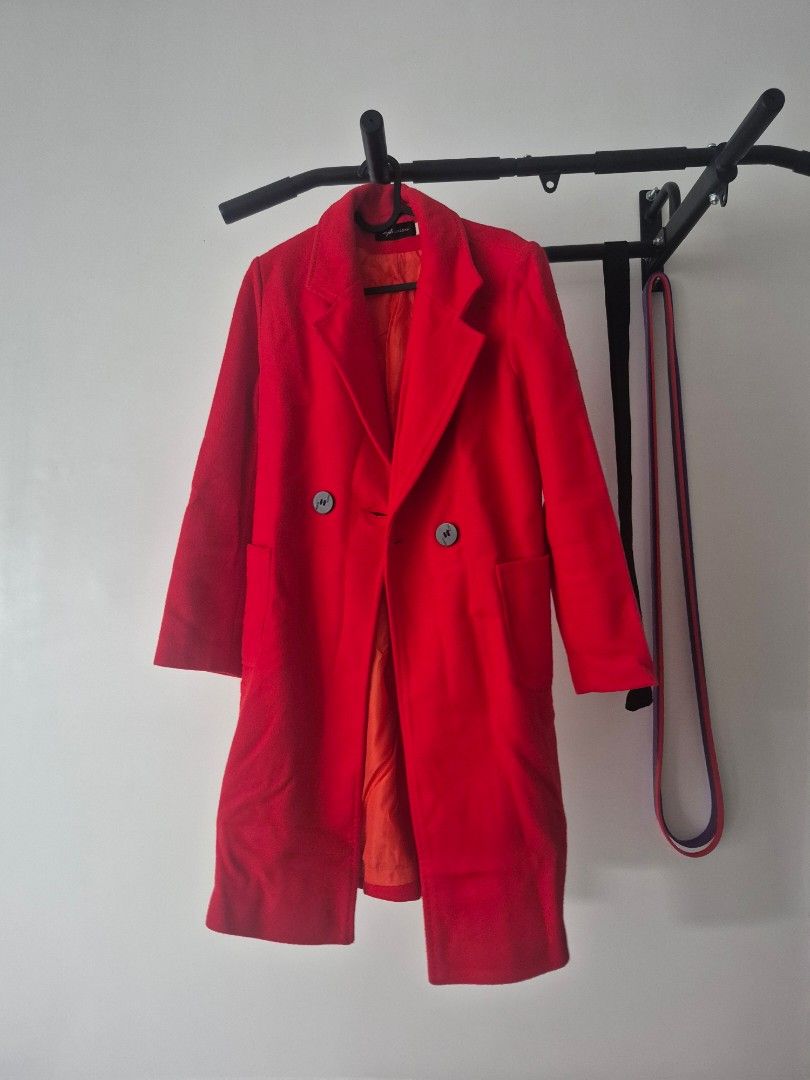 Red wool coat double breasted (Category: Coats, Jackets and Outerwear) located in Paranaque City. Submitted by decluttering.pque (Listing ID 1465847544, Image 1). Description: Used once only Dry cleaned Fits medium frames - Color: Bright red with dark buttons - Style: Double-breasted with lapel collar and front pockets - Lining: Fully lined - Fit & Fabric: Structured fit, thick material for cold weather - Condition: Clean overall.