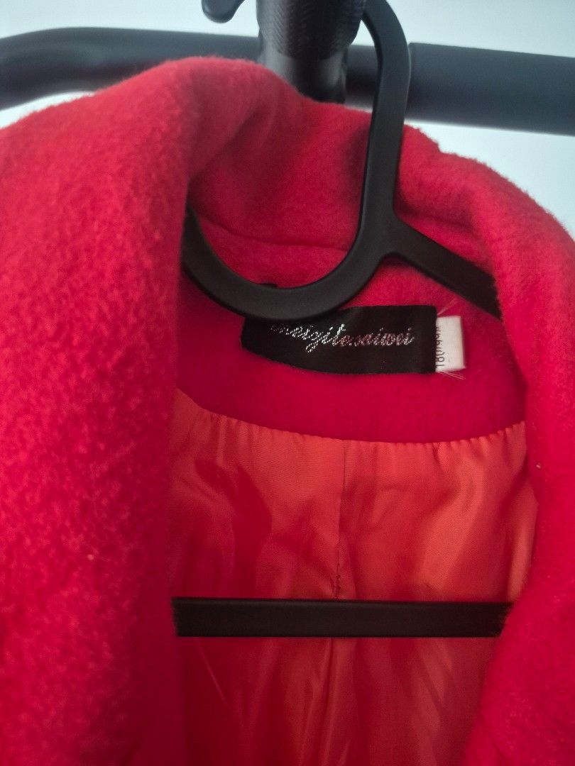 Red wool coat double breasted (Category: Coats, Jackets and Outerwear) located in Paranaque City. Submitted by decluttering.pque (Listing ID 1465847544, Image 3). Description: Used once only Dry cleaned Fits medium frames - Color: Bright red with dark buttons - Style: Double-breasted with lapel collar and front pockets - Lining: Fully lined - Fit & Fabric: Structured fit, thick material for cold weather - Condition: Clean overall.