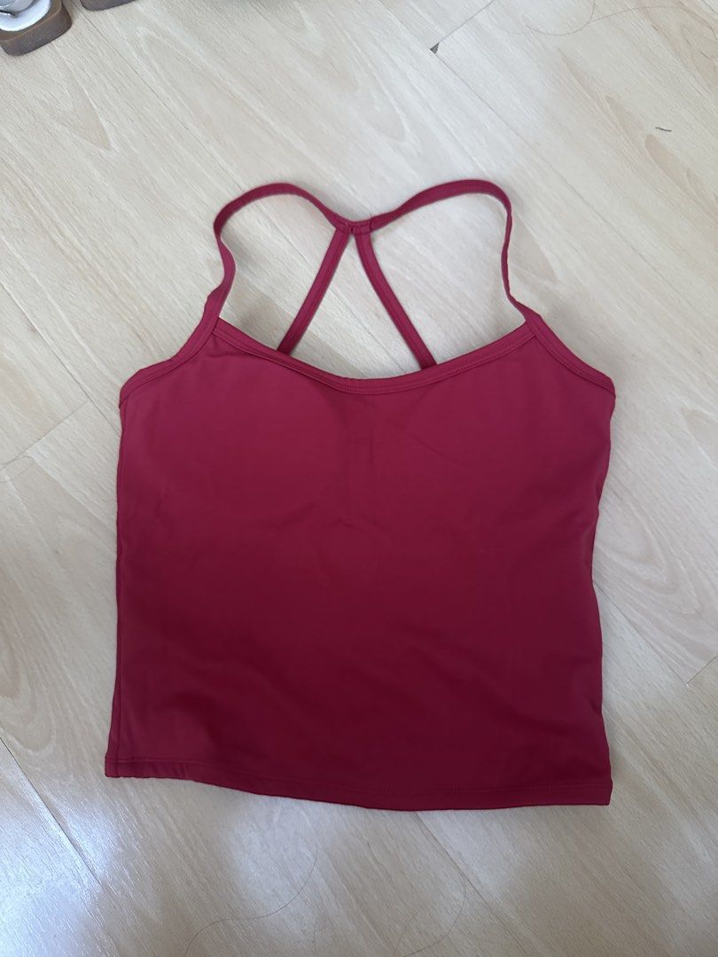 Red Workout Tank Top with Cross Straps (Category: Activewear) located in Cavite. Submitted by _mariposa.mnl (Listing ID 1465833917, Image 1). Description: - Color: Red - Features: Built-in bra padding and unique crisscross back strap design - Material: Soft and stretchy athletic fabric - Best for: Gym sessions, yoga, or daily casual wear - Condition: Clean and well-maintained.