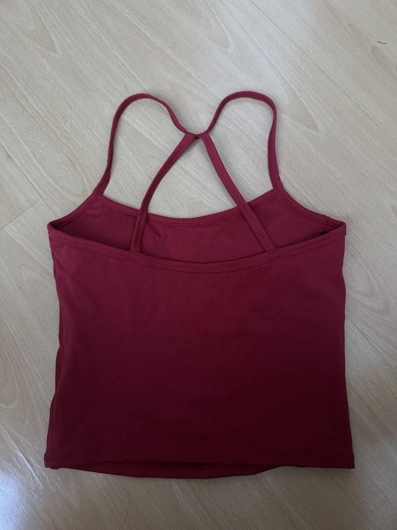 Red Workout Tank Top with Cross Straps (Category: Activewear) located in Cavite. Submitted by _mariposa.mnl (Listing ID 1465833917, Image 2). Description: - Color: Red - Features: Built-in bra padding and unique crisscross back strap design - Material: Soft and stretchy athletic fabric - Best for: Gym sessions, yoga, or daily casual wear - Condition: Clean and well-maintained.