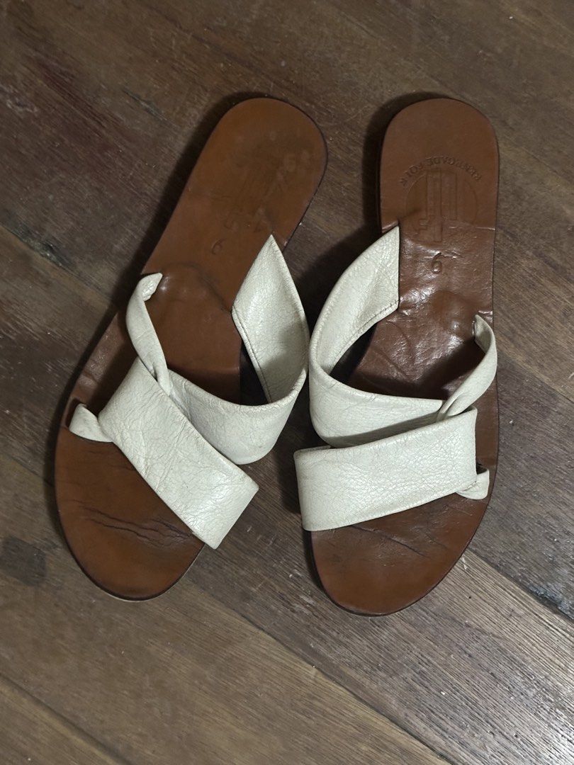 Renegade Folk Leather Sandals Size 9 (Category: Flats & Sandals) located in Makati City. Submitted by biancak20 (Listing ID 1465905109, Image 1). Description: - Brand: Renegade Folk - Style: Slip-on sandals with crisscross straps and open toe - Colorway: White and brown - Size: 9( stamped on footbed) - Material: Leather upper and sole - Condition: Pre-loved with natural wear lines on the sole - Perfect for effortless warm-weather styling.