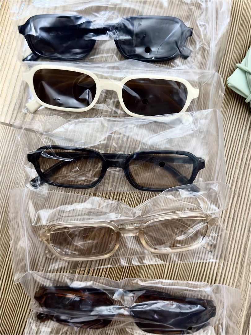 Retro Rectangular Sunglasses Bundle Various Colors (Category: Sunglasses & Eyewear) located in San Juan City. Submitted by pewchipie (Listing ID 1465892245, Image 2). Description: - Quantity: 5 pairs of rectangular sunglasses - Colors & Patterns: Solid black, cream frame with dark lenses, dark grey, translucent beige, and tortoiseshell - Style: Thick frames, vintage Y2K aesthetic - Condition: Brand new, unopened in original bags, never worn - Per