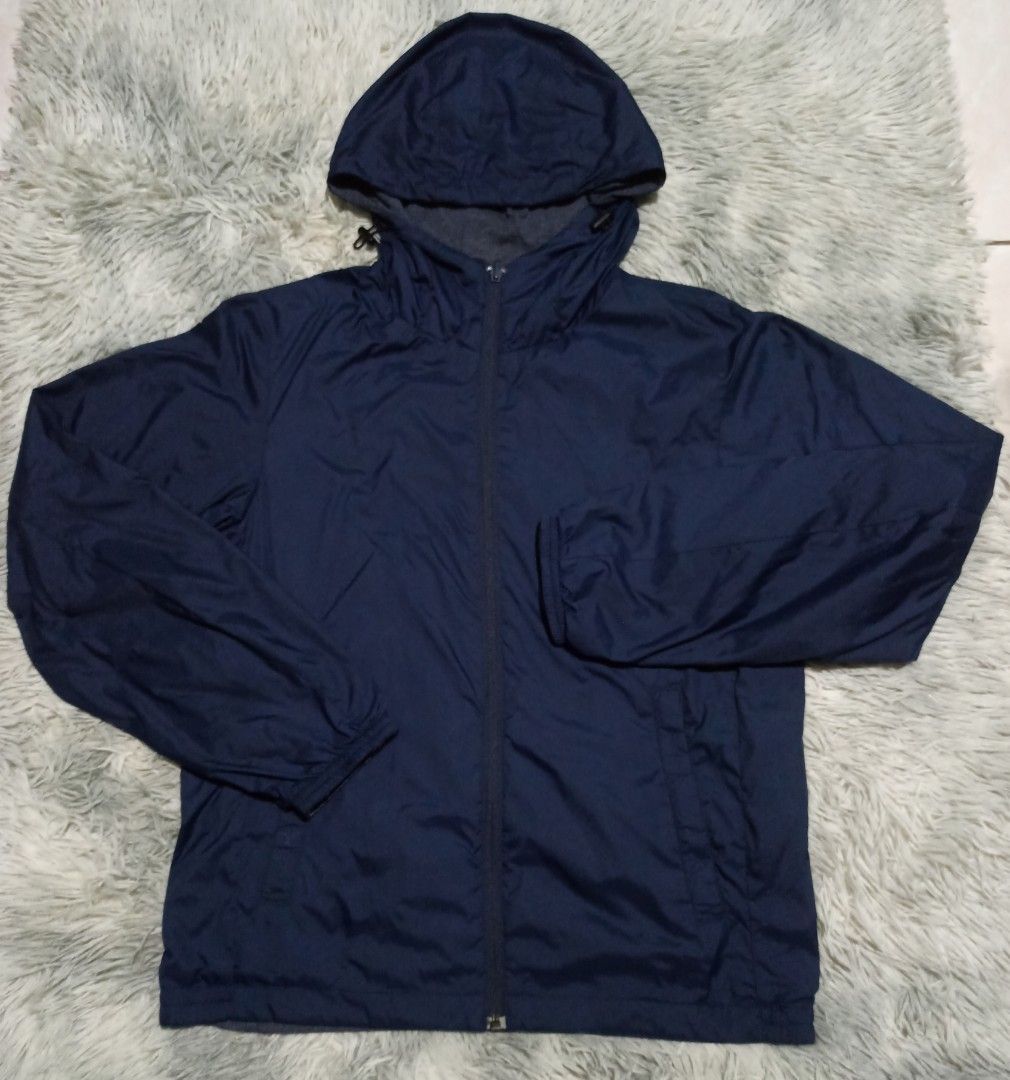 Reversible Blue and Grey Hooded Jacket (Category: Coats, Jackets and Outerwear) located in Alaminos. Submitted by aj_collection28 (Listing ID 1465950223, Image 2). Description: - 2-in-1 reversible design: solid blue nylon on one side, grey heathered knit on the other -Size: Small - Color: Navy Blue -Dimes: 20.5W x 24L - Functional pockets available on both sides - Drawstring hood for an adjustable, comfortable fit - Lightweight material, ideal fo