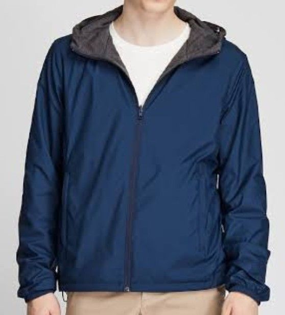 Reversible Blue and Grey Hooded Jacket (Category: Coats, Jackets and Outerwear) located in Alaminos. Submitted by aj_collection28 (Listing ID 1465950223, Image 1). Description: - 2-in-1 reversible design: solid blue nylon on one side, grey heathered knit on the other -Size: Small - Color: Navy Blue -Dimes: 20.5W x 24L - Functional pockets available on both sides - Drawstring hood for an adjustable, comfortable fit - Lightweight material, ideal fo