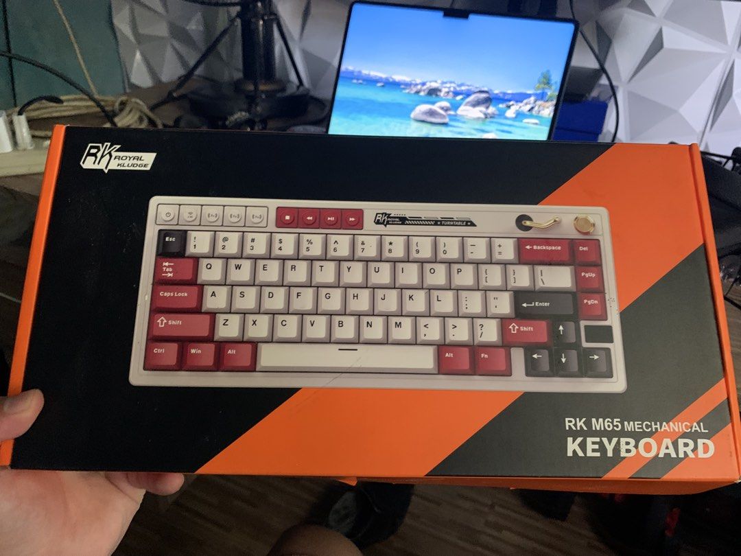 RK Royal Kludge M65 Mechanical Keyboard (Category: Computer Keyboard) located in San Mateo. Submitted by mattoramirez (Listing ID 1465831023, Image 1). Description: - Model: RK M65 mechanical keyboard - Colorway: White and red - Layout: Compact with volume knob and media keys - Condition: Clean and fully functional (used only once) - Inclusions: Original box, USB-C cable, keycap puller, and extra switches - Perfect for: Gaming and typing setups C