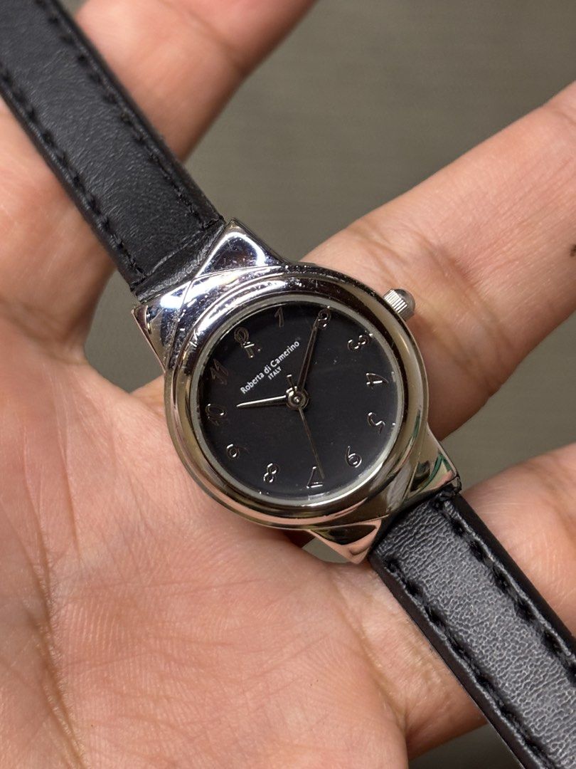 Roberta di Camerino Bow Lug Quartz (Category: Women's Watches) located in Manila. Submitted by soughtafterseconds (Listing ID 1465793723, Image 2). Description: Roberta di Camerino Bow Lug Quartz This Roberta di Camerino Sculpted Bow-Lug Quartz Watch is a stylish piece of Italian fashion horology, featuring an integrated bow/ribbon lug structure paired with a minimal dark dial face. Founded in Venice, Italy, in 1945 by Giuliana Coen (who adopted 