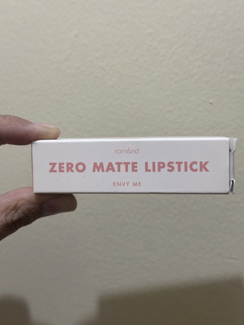 Rom&nd Zero Matte Lipstick 07 Envy Me (Category: Makeup) located in Quezon City. Submitted by kbeautyfinds (Listing ID 1465934880, Image 2). Description: - Brand: Rom&nd Zero Matte Lipstick - Shade: 07 Envy Me (Warm nude, perfect for daily wear) - Finish: Lightweight with a smooth, matte finish - Condition: Brand new, unopened box packaging - Expiry Date: October 2027.