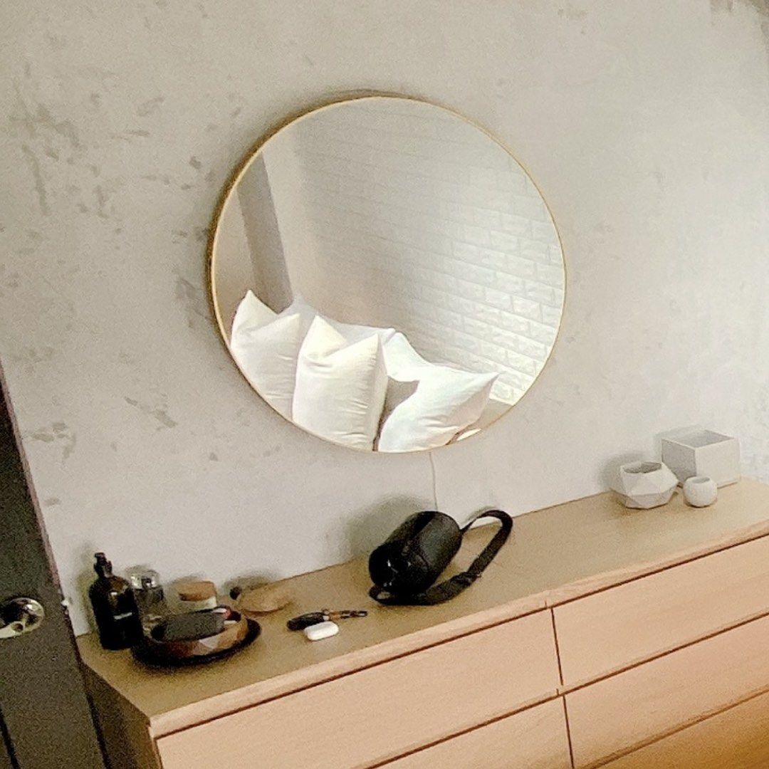 Round Wall Mirror with Gold Metal Frame (Category: Mirrors) located in Taguig. Submitted by boxedgoodies (Listing ID 1465877101, Image 2). Description: - Elegant round wall mirror with a thin gold-toned metal frame - Flawless glass with zero scratches, cracks, or defects - Perfect size to open up small spaces and bounce natural light around - Secure hanging hardware already mounted at the back - Ideal for living rooms, entryways, or bedrooms - Se