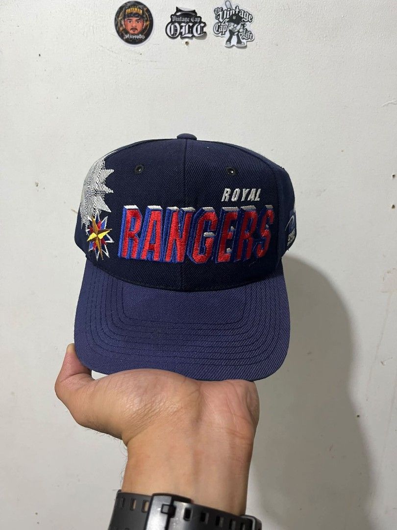 Royal Rangers Shadow By SS (Category: Caps & Hats) located in Quezon City. Submitted by embonjesselle (Listing ID 1465786039, Image 1). Description: - Color: Navy blue - Design: Bold red and blue embroidered lettering with side star emblem - Style: Flat brim, structured fit with crown eyelets - Fit: Adjustable closure in the back - Condition: Clean stitching throughout - Perfect for: Daily wear or collectors.