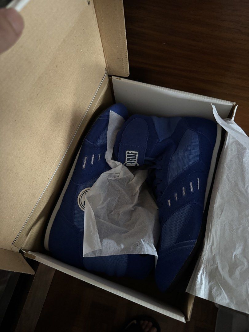 Rside Blue Boxing Shoes in Original Box (Category: Sneakers) located in Manila. Submitted by seangoart (Listing ID 1465765906, Image 1). Description: - Brand: Rside - Style: High-top boxing shoes - Color: Vibrant blue - Condition: Brand new, never worn, in original box with tissue paper - Features: Breathable mesh panels, secure Velcro ankle strap, and durable suede overlays.