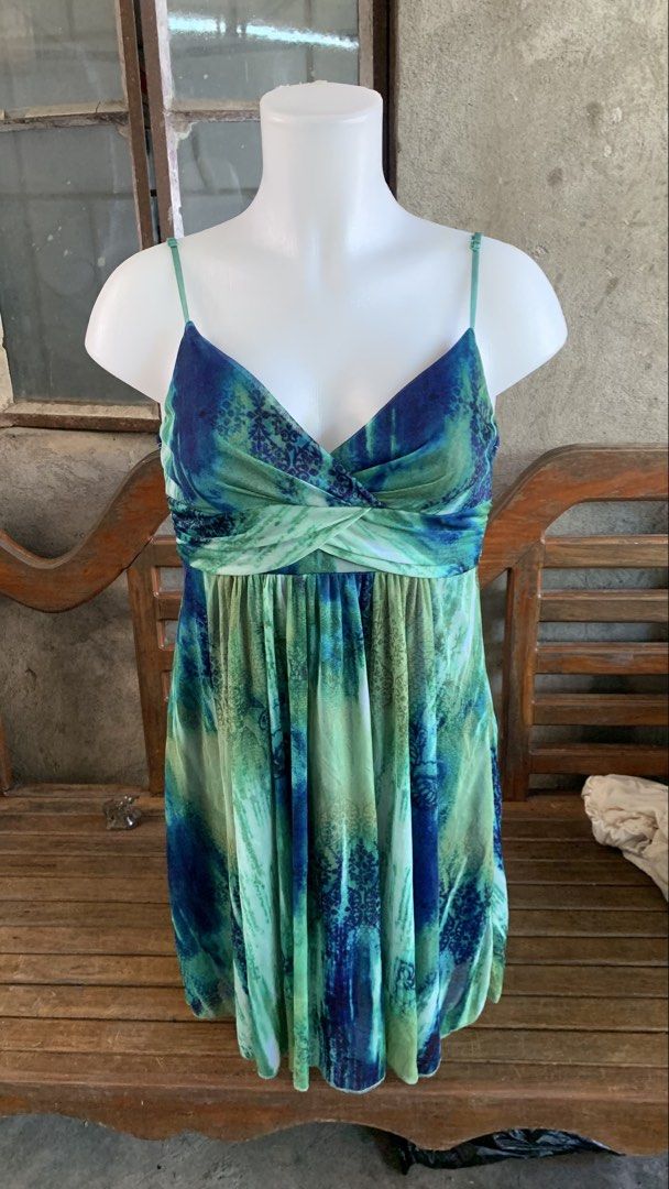Ruby Rox Blue Green Tie Dye Dress Size S (Category: Dresses) located in Manila. Submitted by thriftnivee (Listing ID 1465782406, Image 1). Description: - Brand: Ruby Rox (Tag attached) - Size: Small - Color/Pattern: Blue and green tie dye - Neckline: V-neck with twisted fabric detail - Straps: Spaghetti straps - Features: Lightweight layered fabric with royal blue lining and adjustable back tie sash -size bust 35 waist 26.